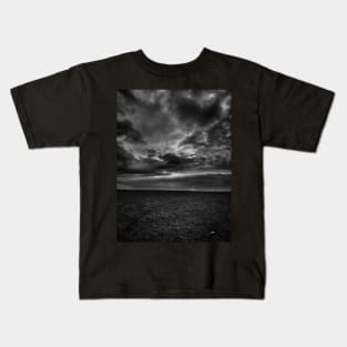 Stormy skies tiny lighthouse Kids T-Shirt